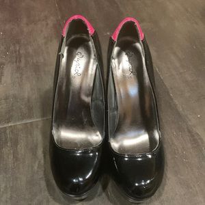 Black and hot pink high heels
